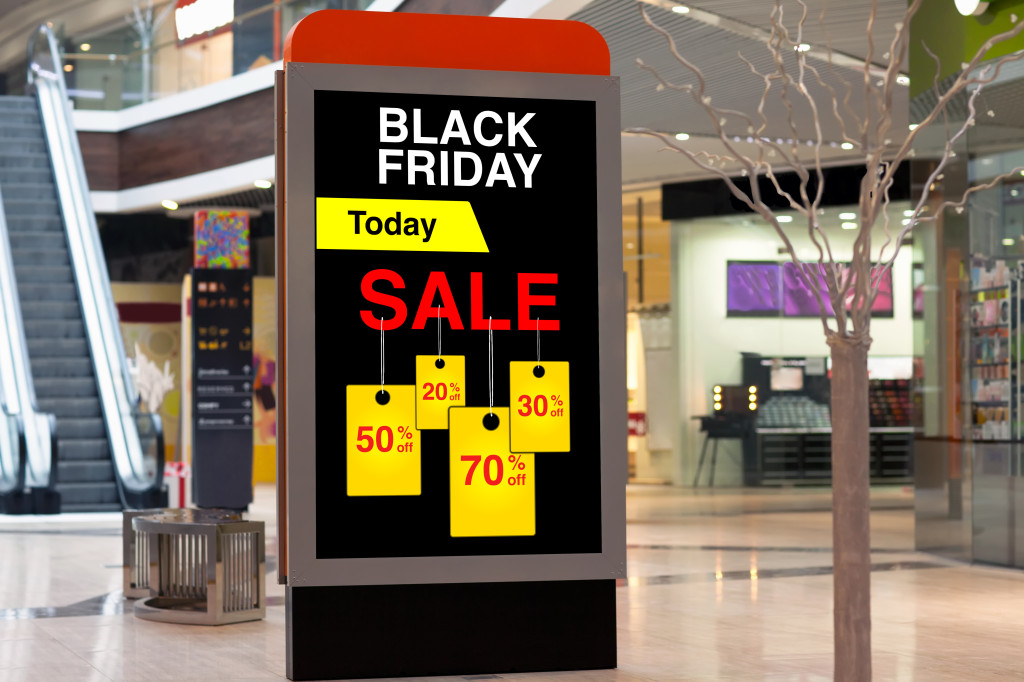 billboard advertising Black Friday and discounts in middle large